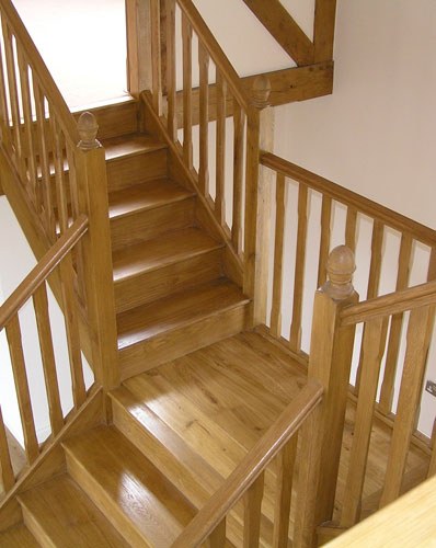 Timber staircase with a turning flight and timber balustrade