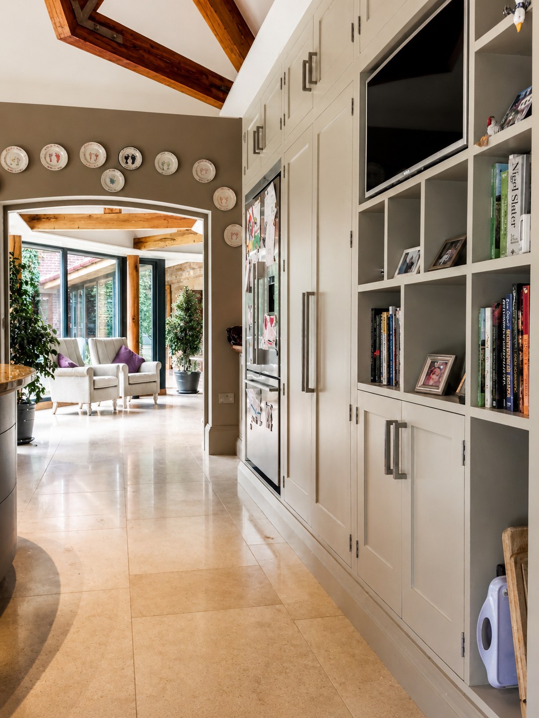 Floor-to-ceiling bookcases beside an internal doorway