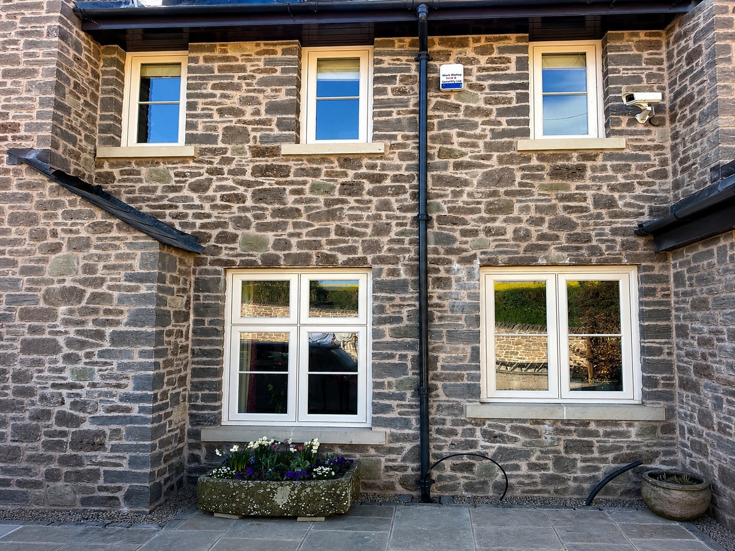 Painted casement windows on a stone house