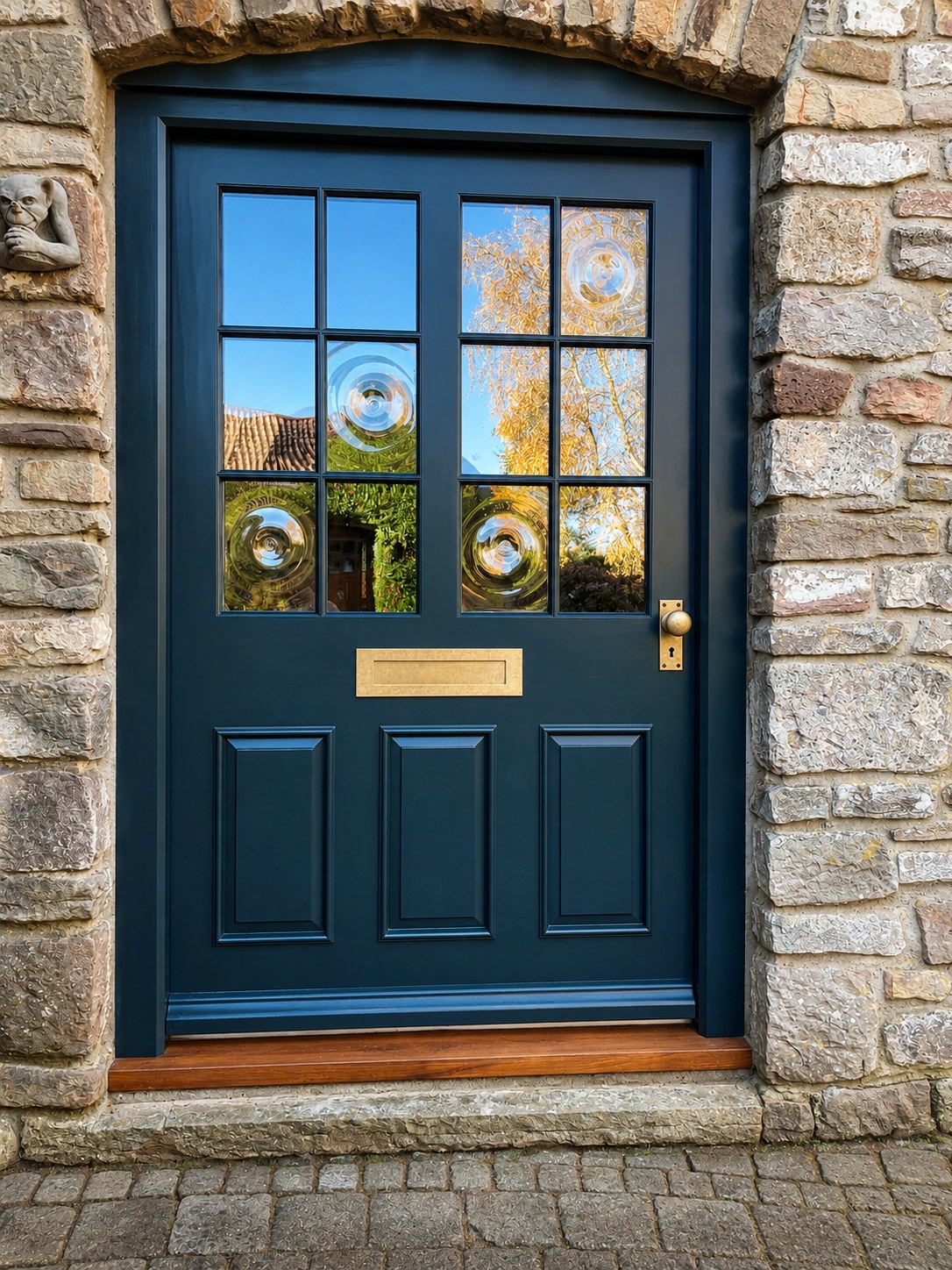 Dark painted entrance door with glazed upper panels