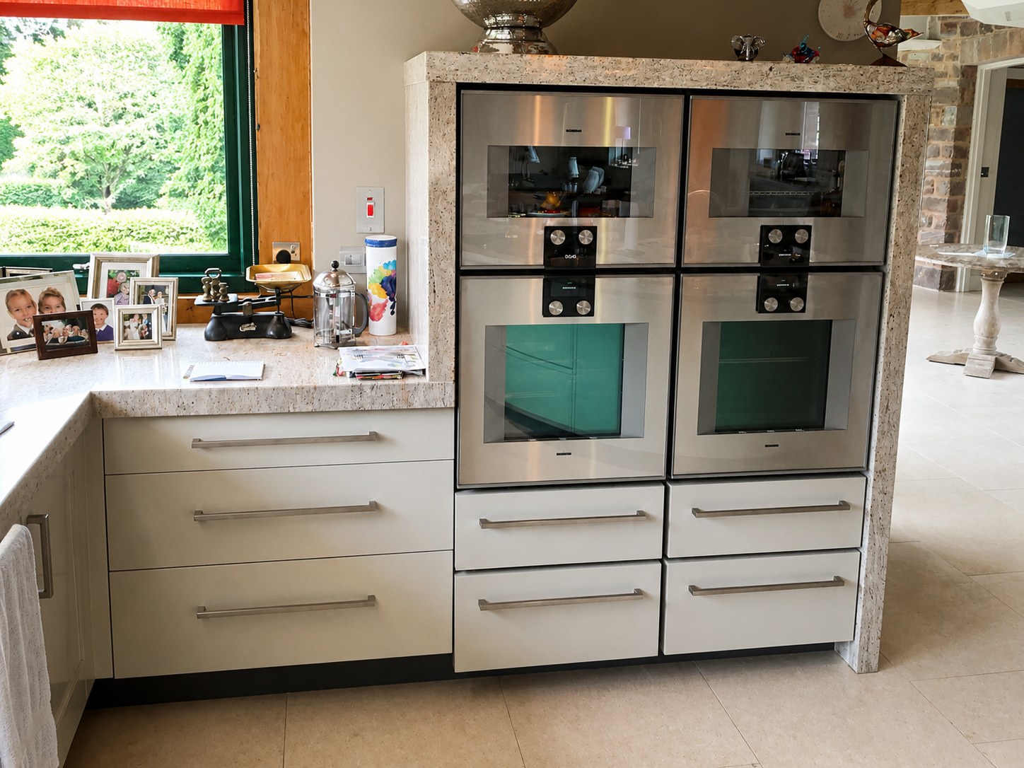 Kitchen cabinets fitted around two ovens