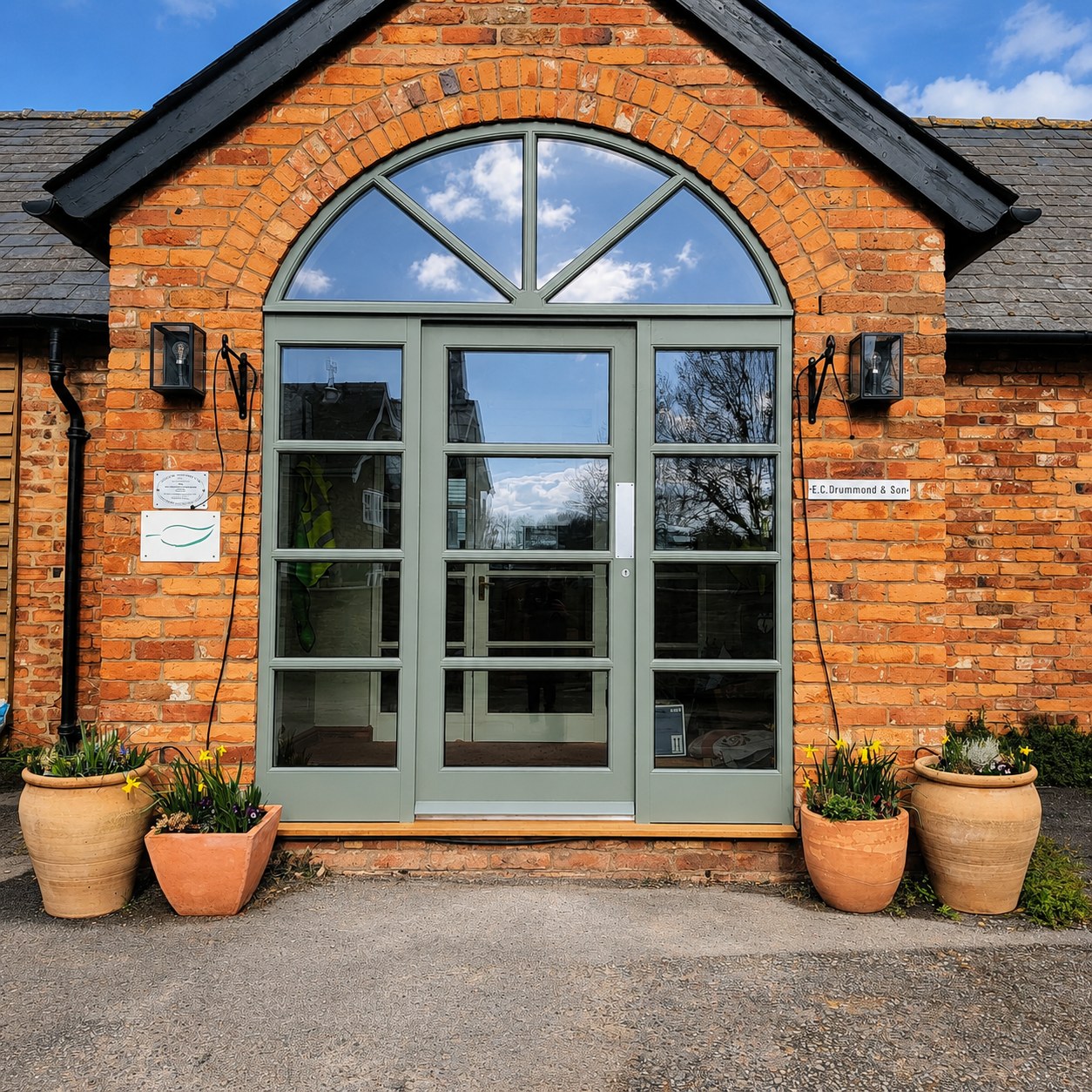 Glazed entrance beneath an arched fanlight