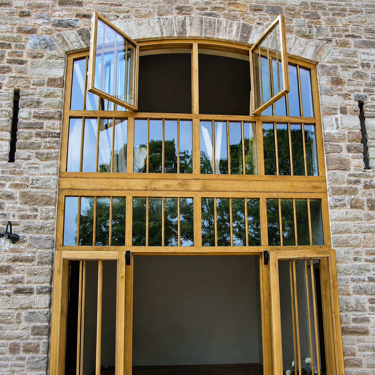 Tall timber screen and doors during installation
