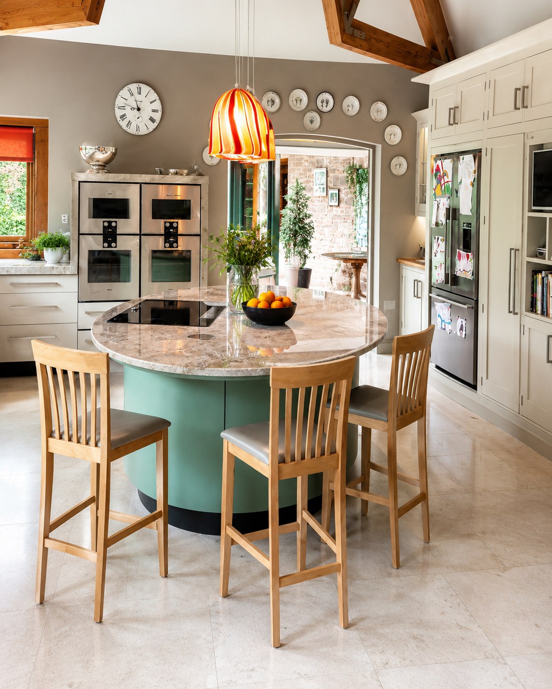 Curved kitchen island and fitted cabinets
