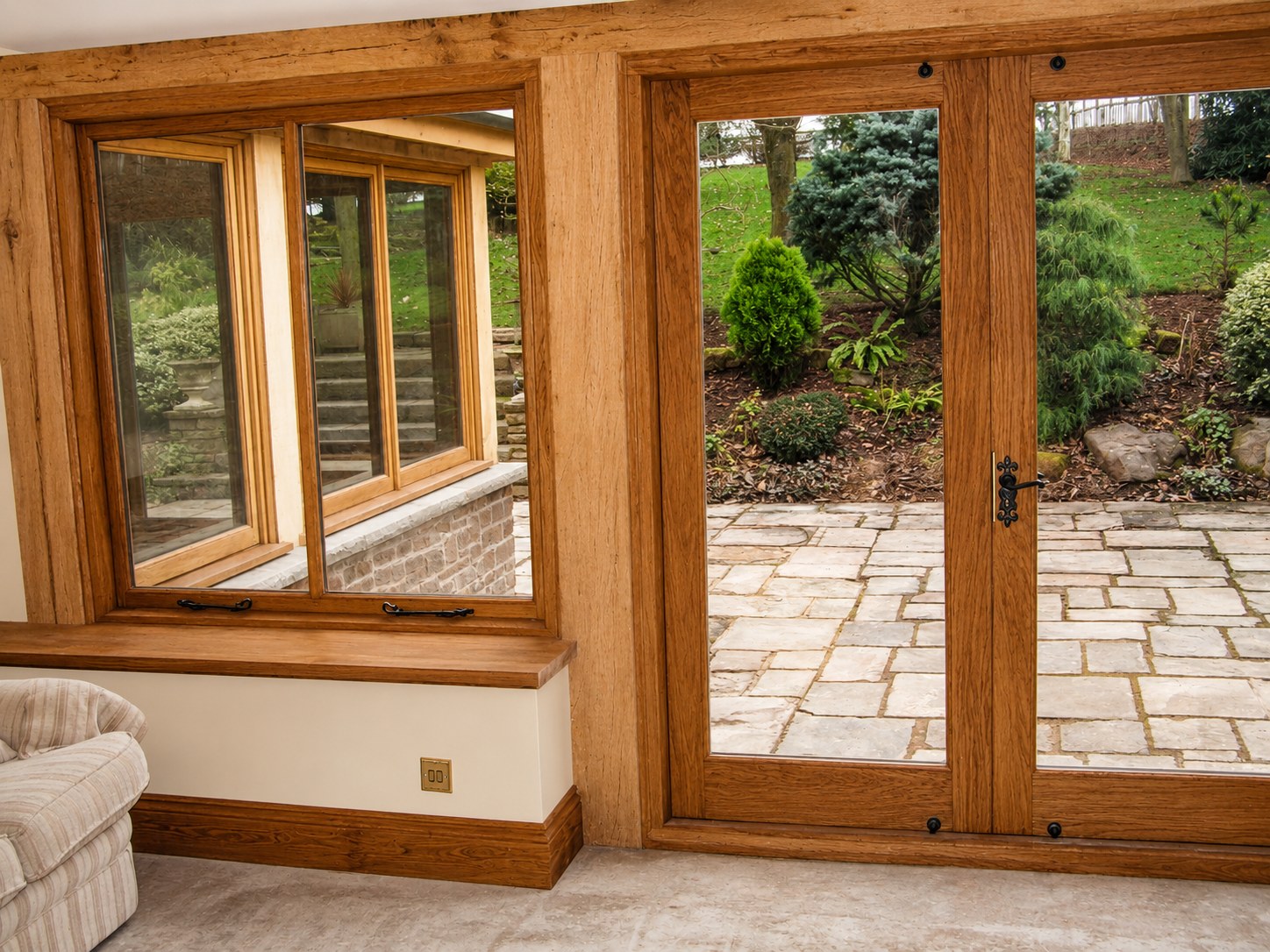 Garden-room doors beside a timber window seat
