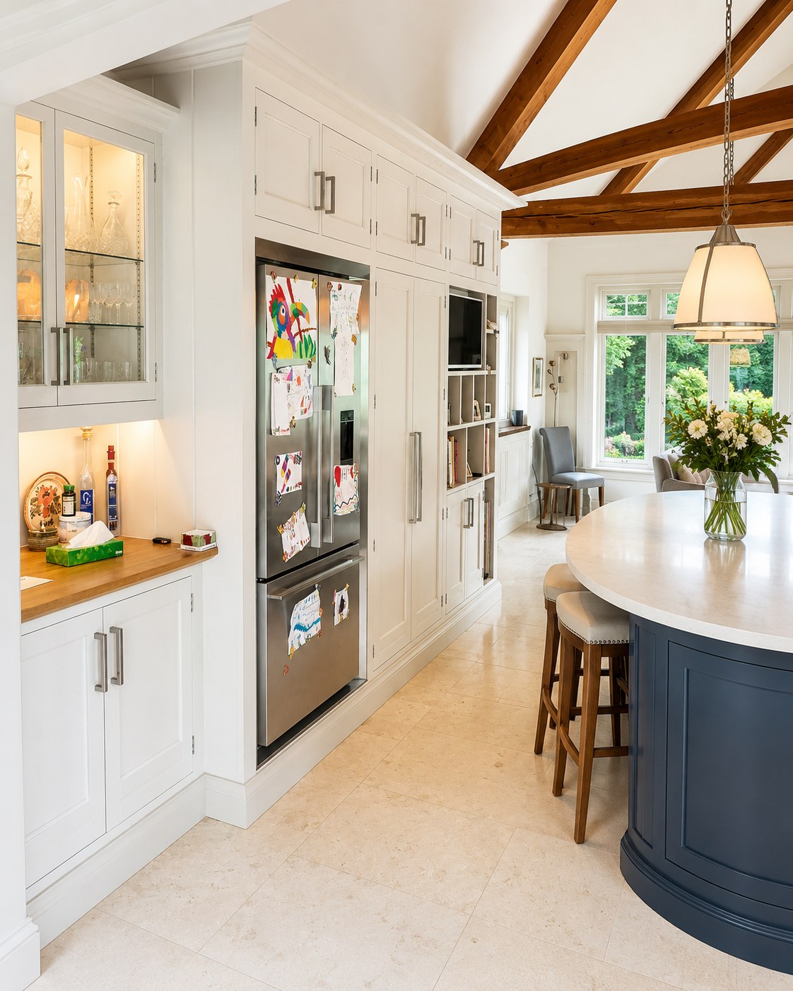 Painted kitchen cabinetry below exposed timber beams