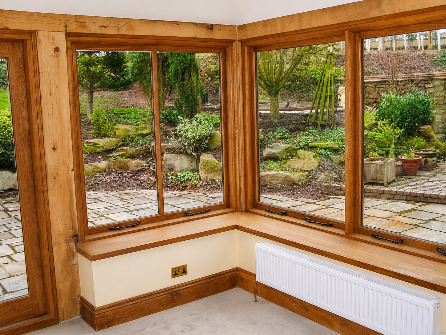 Timber windows meeting at a garden-room corner