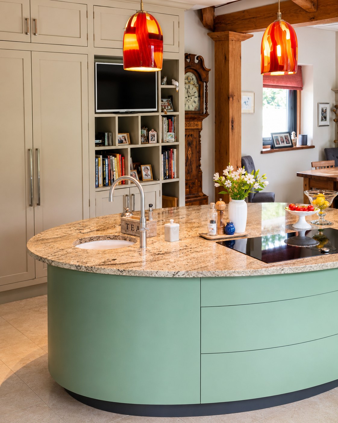 Curved painted kitchen island and stone worktop