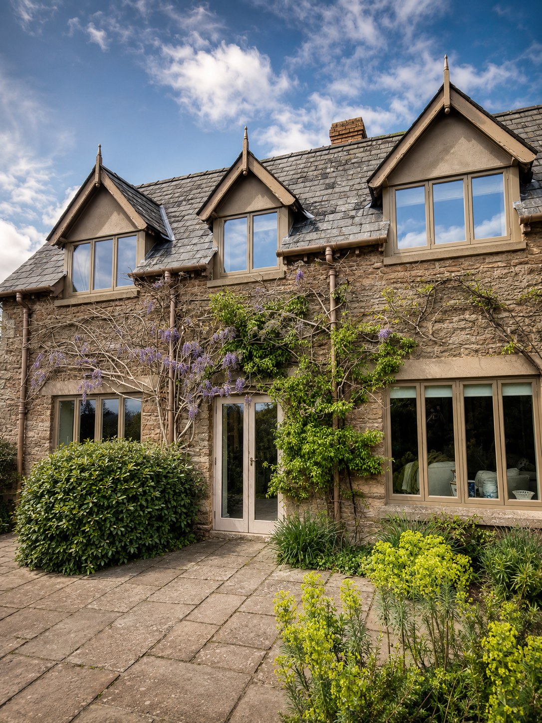 Timber windows and doors across a stone house