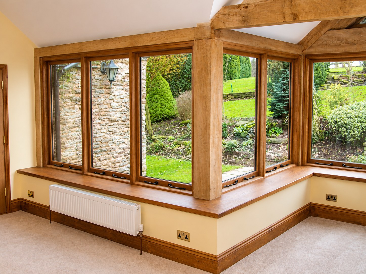 Timber window seat and garden-room corner glazing