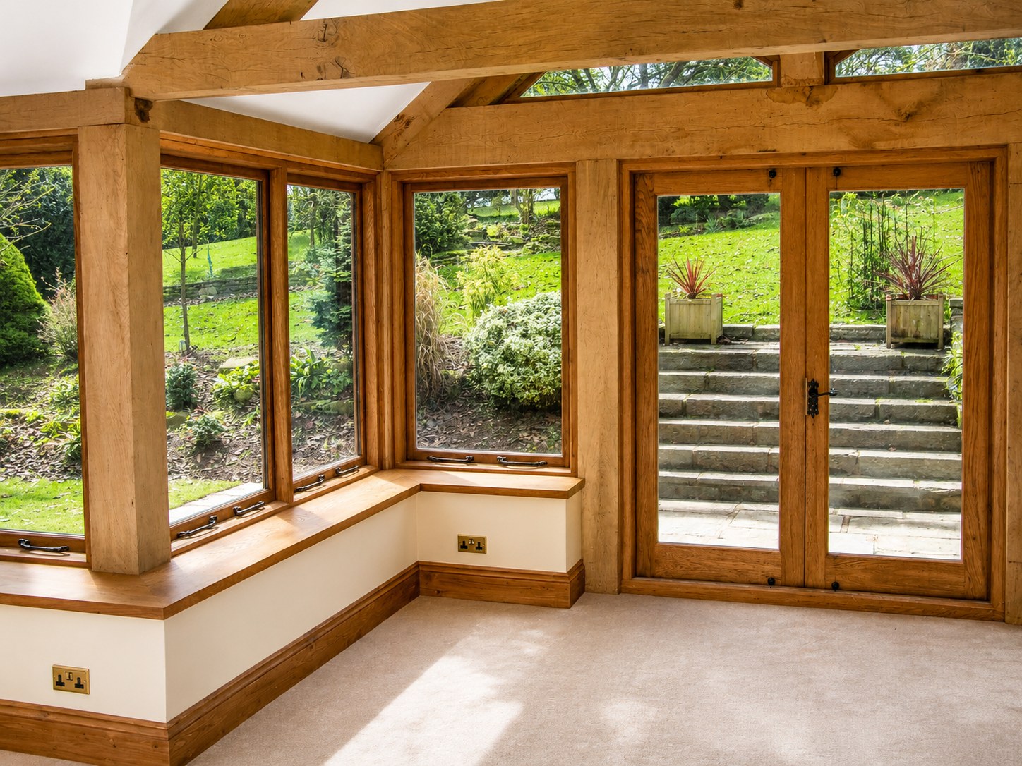 Garden-room corner with timber joinery and glazing