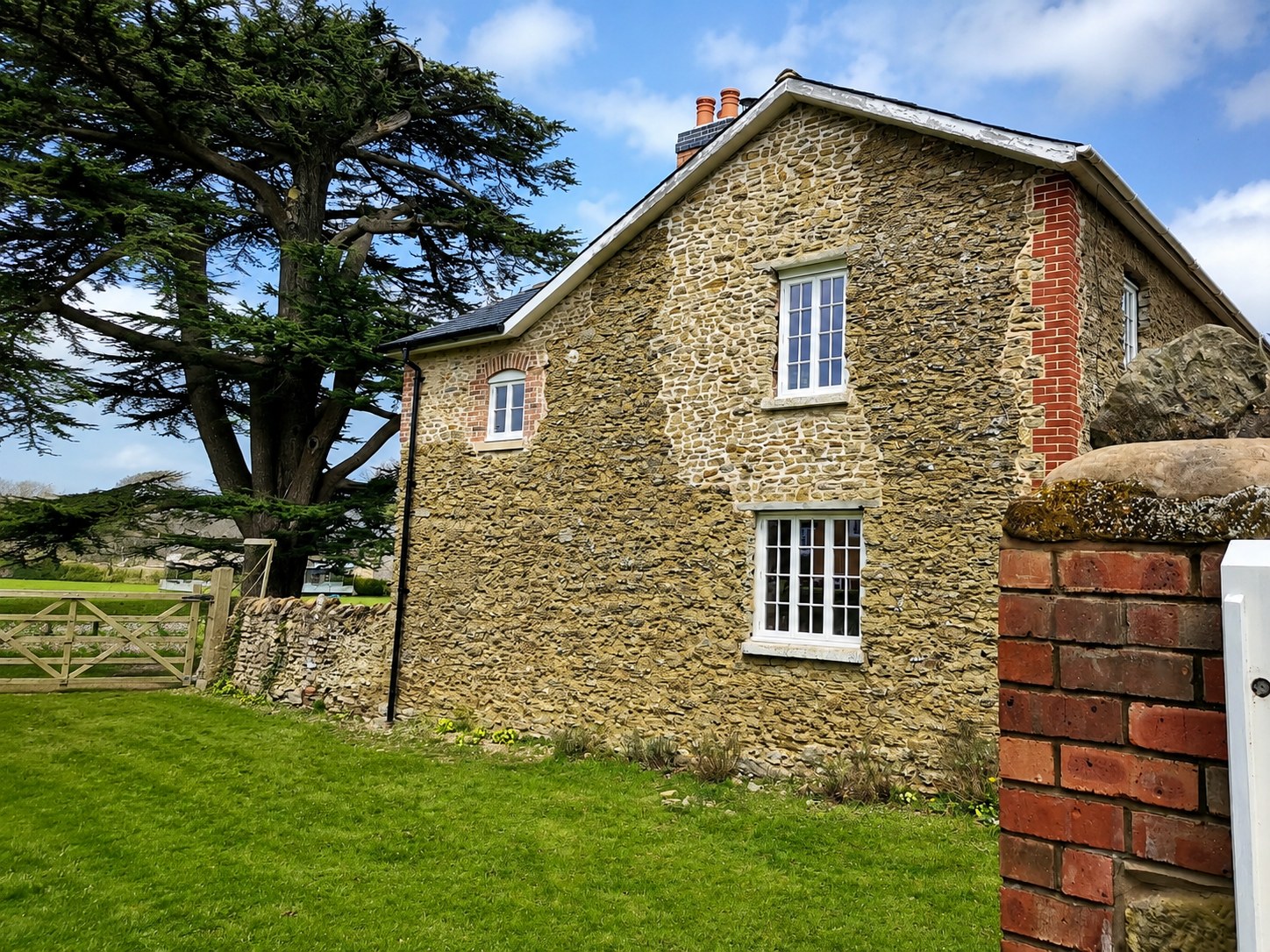 Stone building with tall divided-light windows
