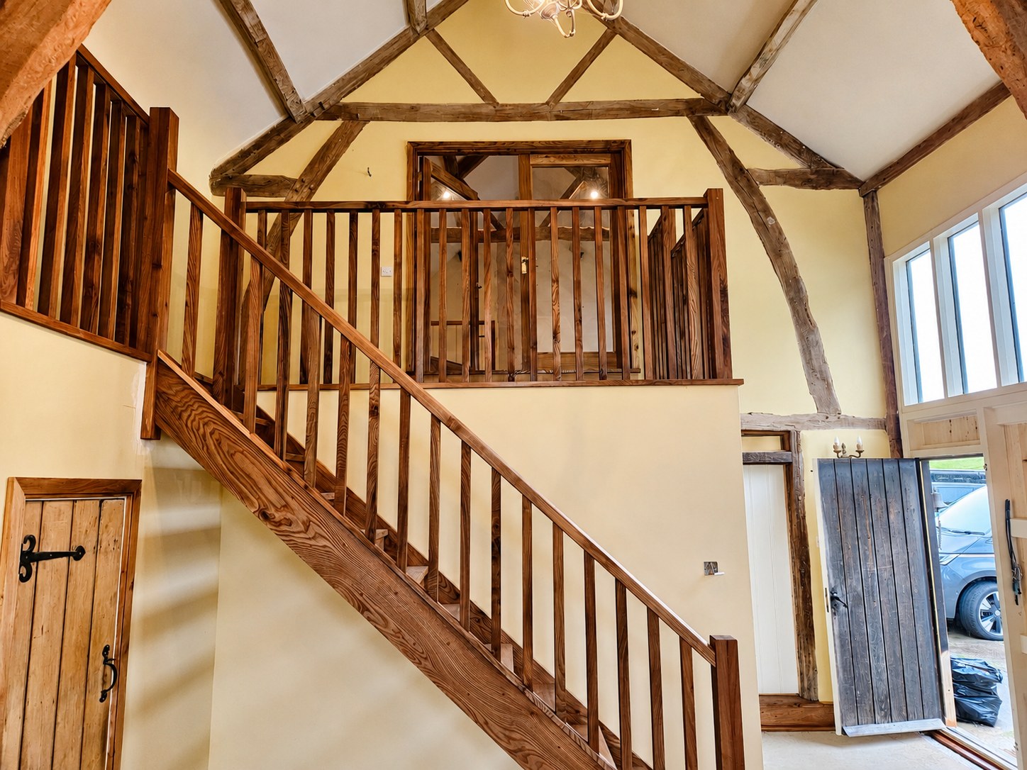Timber staircase and gallery landing under exposed beams