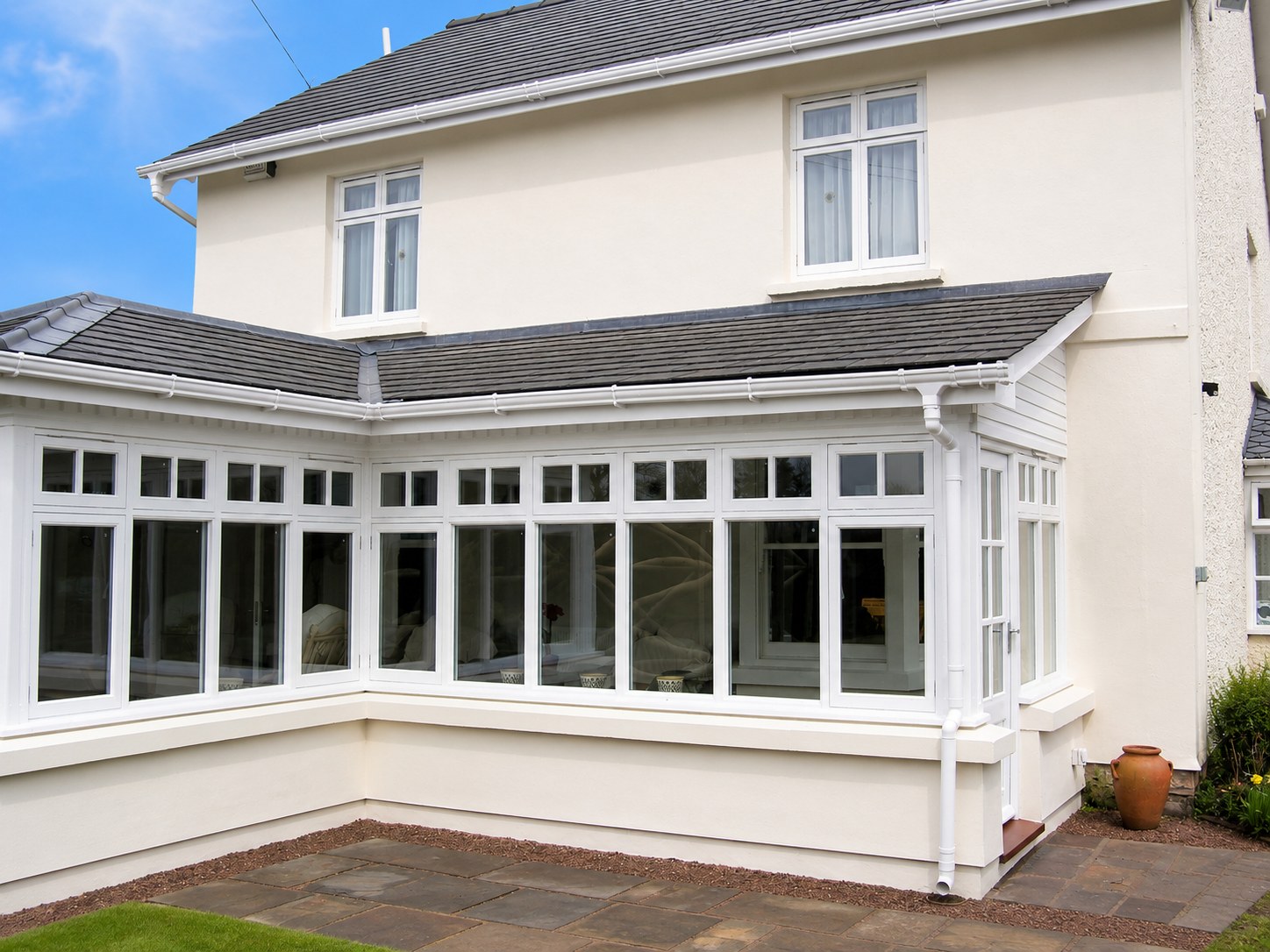 Painted conservatory wrapping around a house