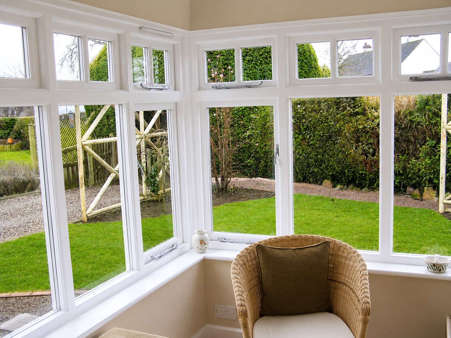 Painted conservatory windows viewed from a seating area