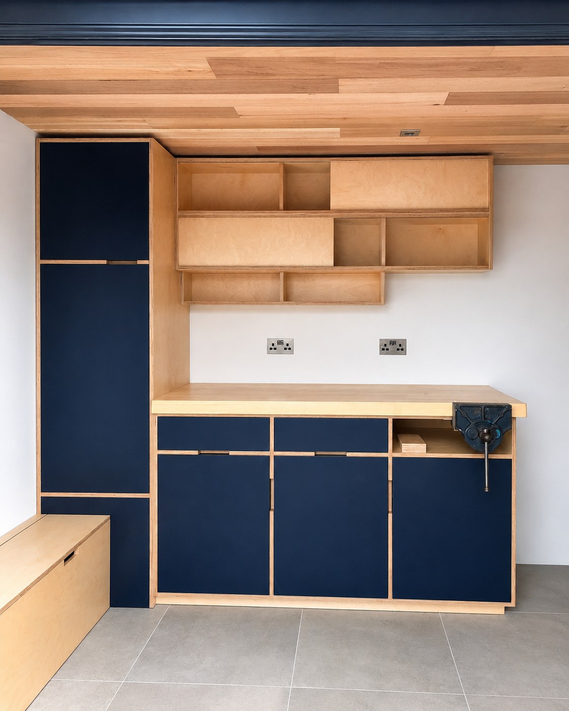 Dark kitchen base cabinets and timber wall shelving