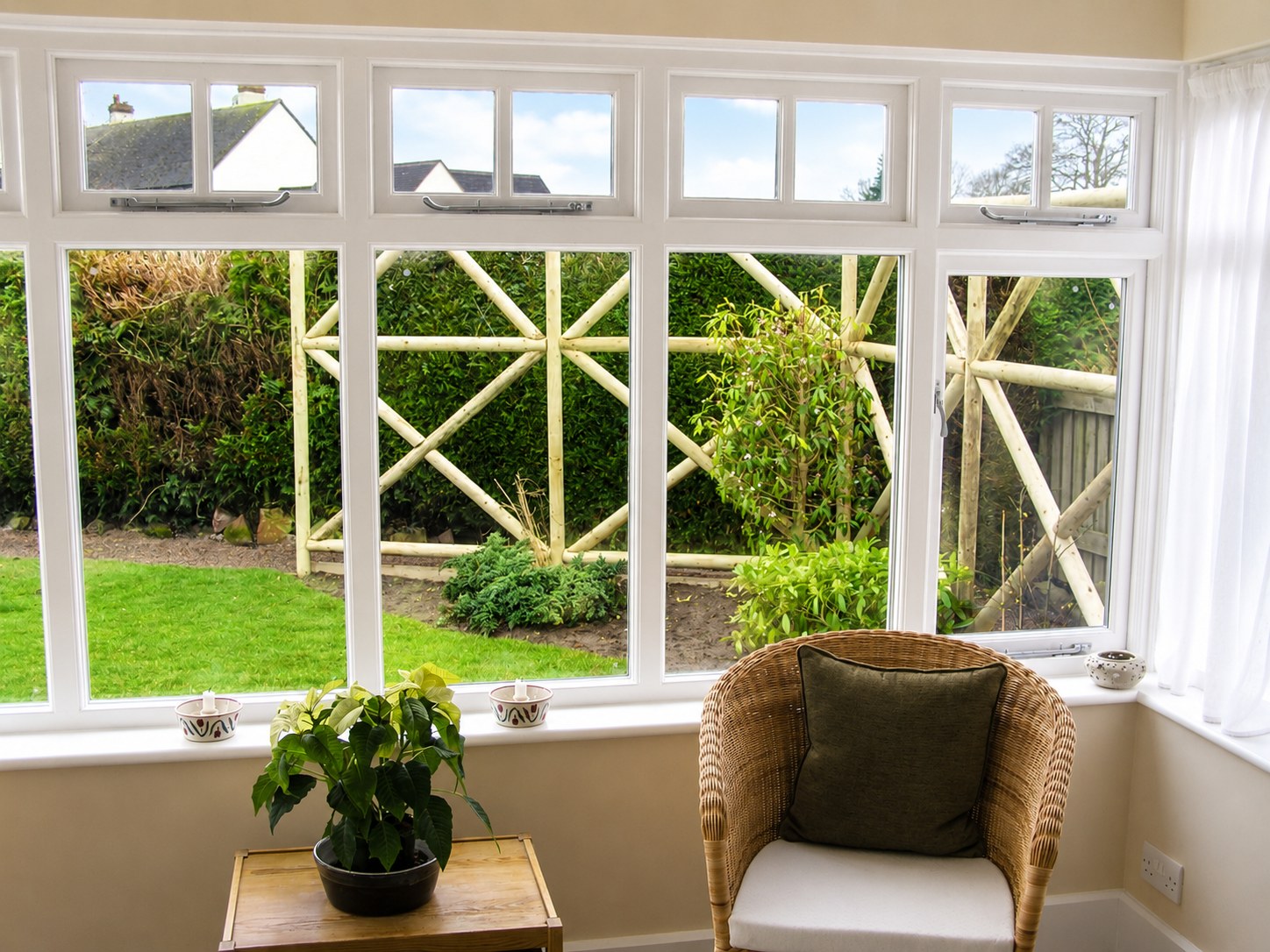 Divided-light conservatory windows overlooking a garden