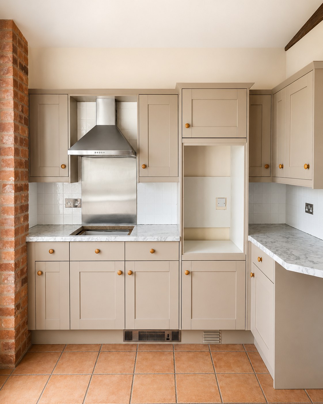 Kitchen cabinets fitted around a hob and extractor