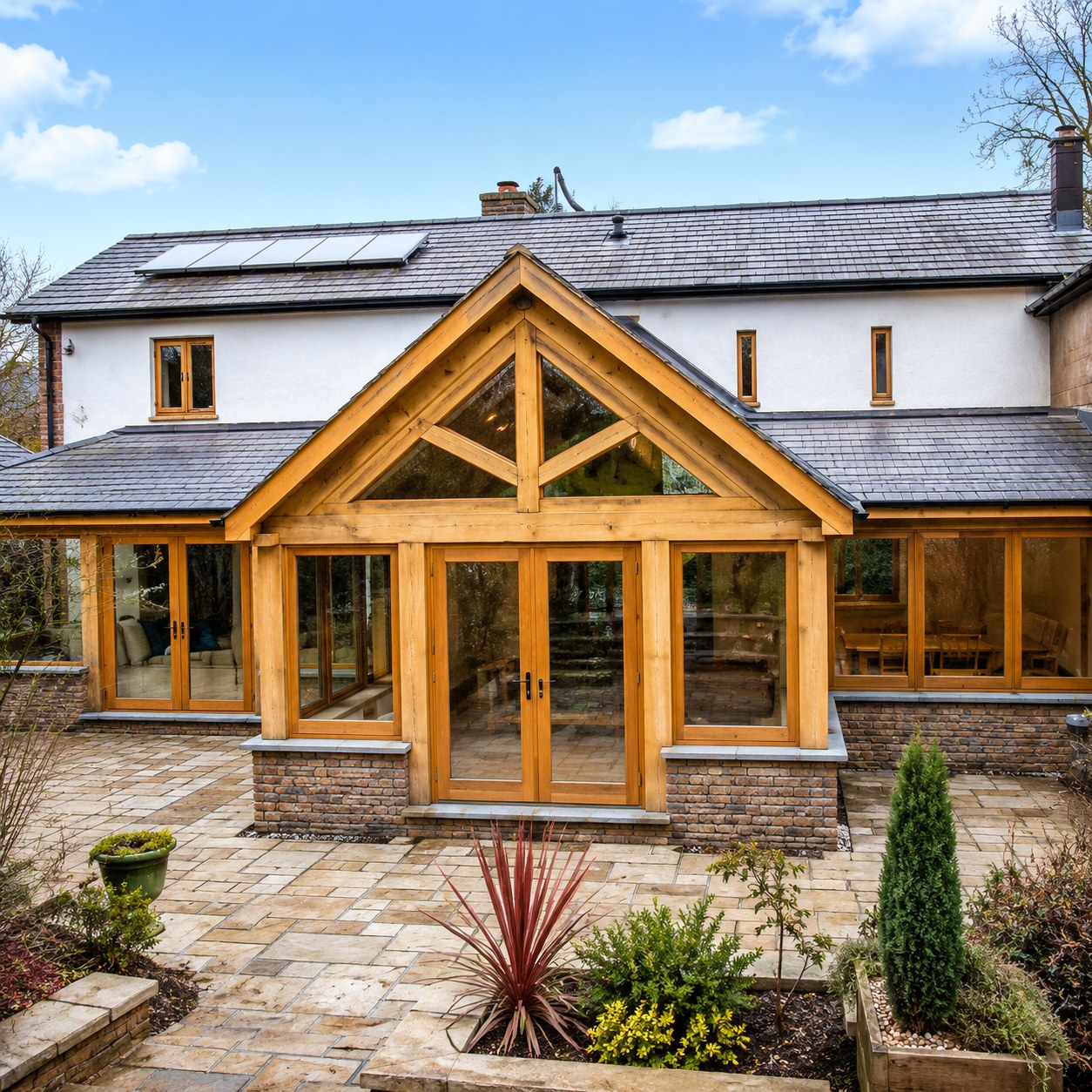 Timber garden room with a gabled glazed entrance