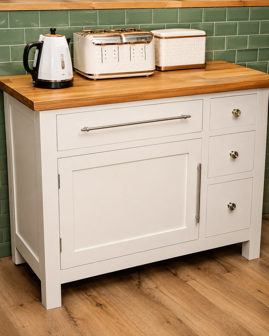 Painted kitchen drawers beneath a timber worktop