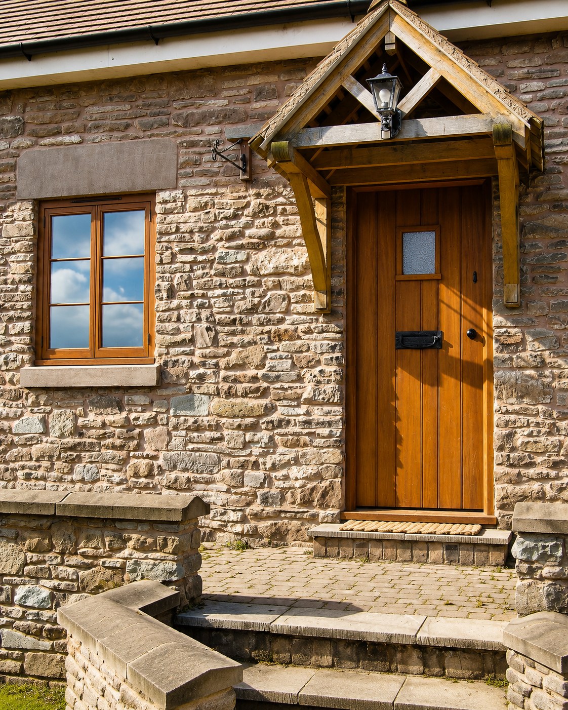 Timber entrance door and pitched porch canopy