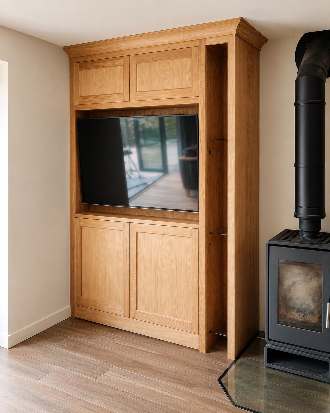 Timber media cabinet fitted beside a fireplace