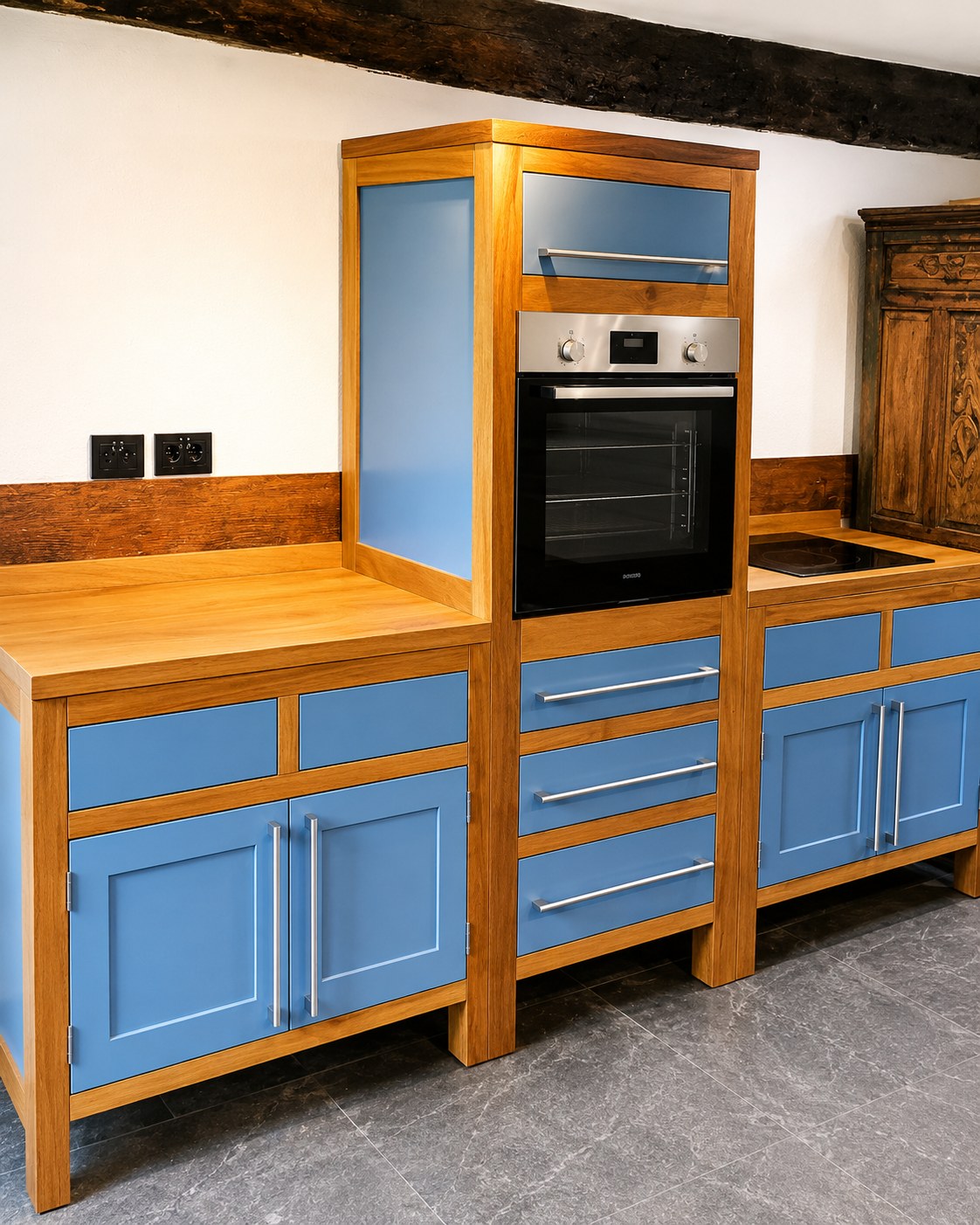 Blue-painted kitchen cabinets with timber surrounds