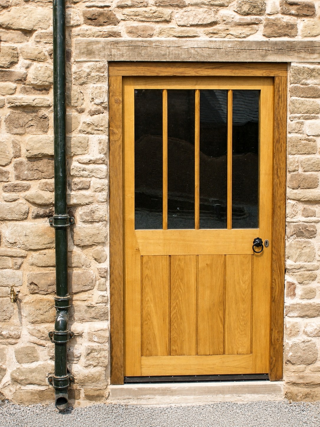 Timber entrance door with divided upper glazing