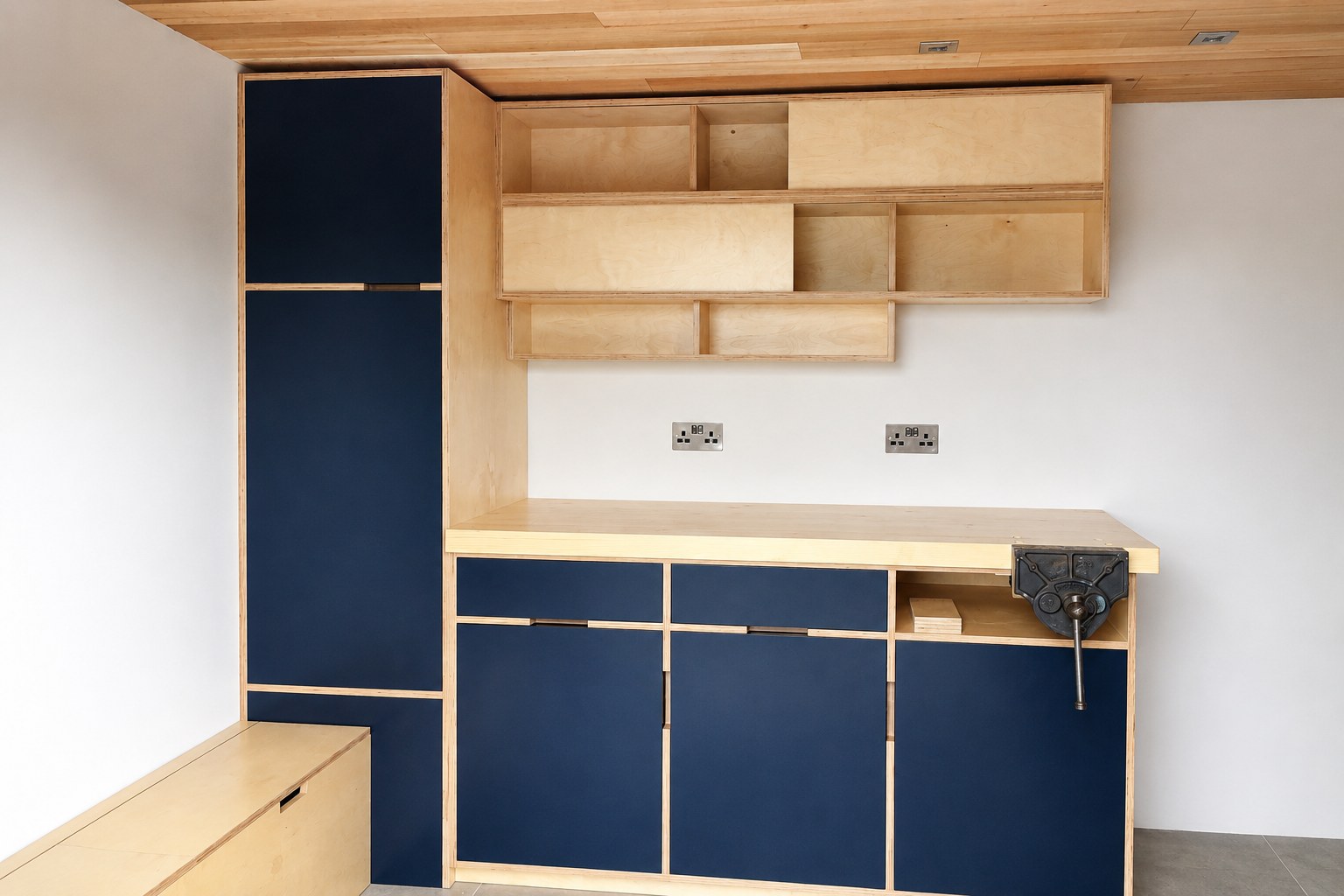 Dark kitchen cupboards and timber display shelves