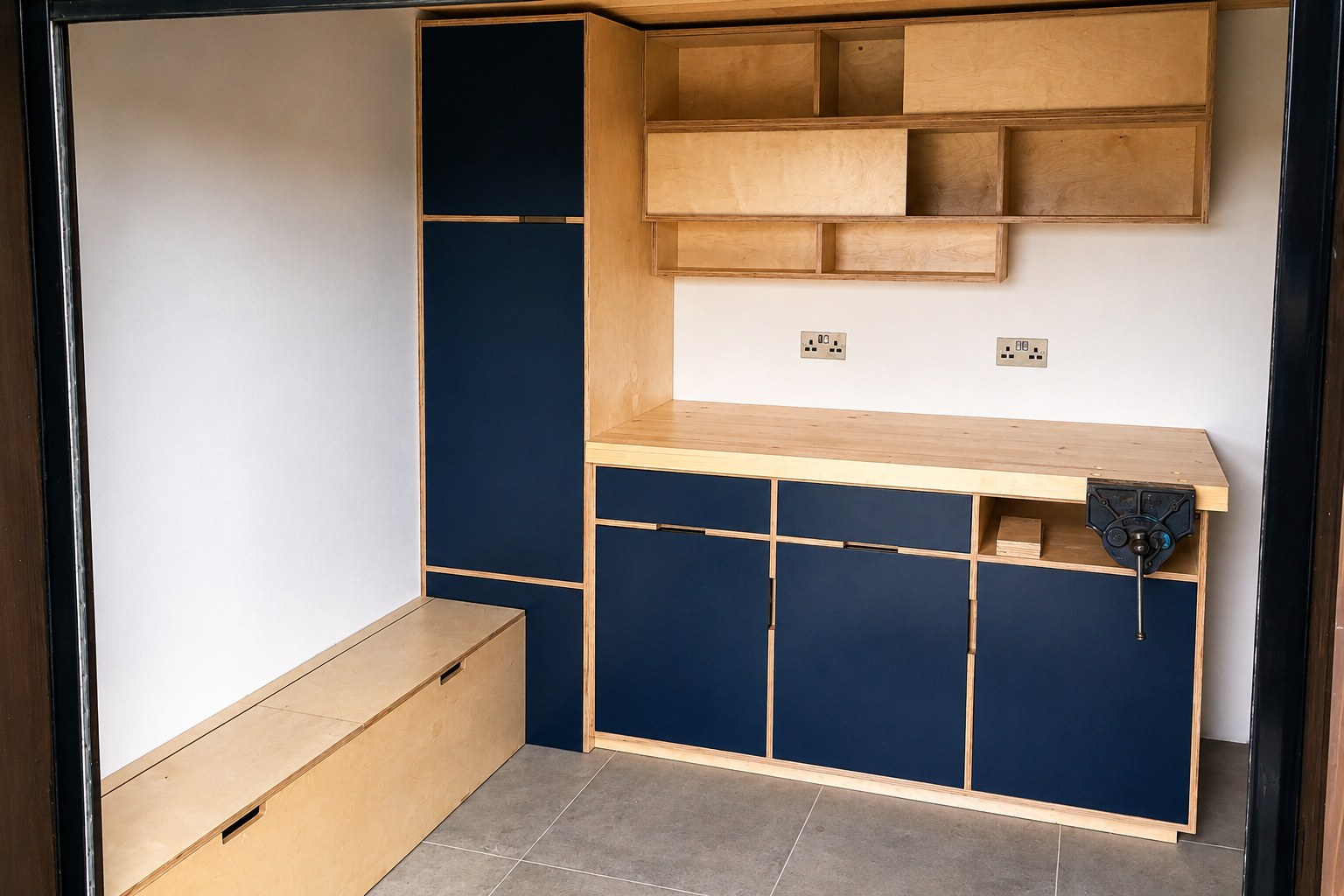Kitchen base cabinetry and timber shelves during installation