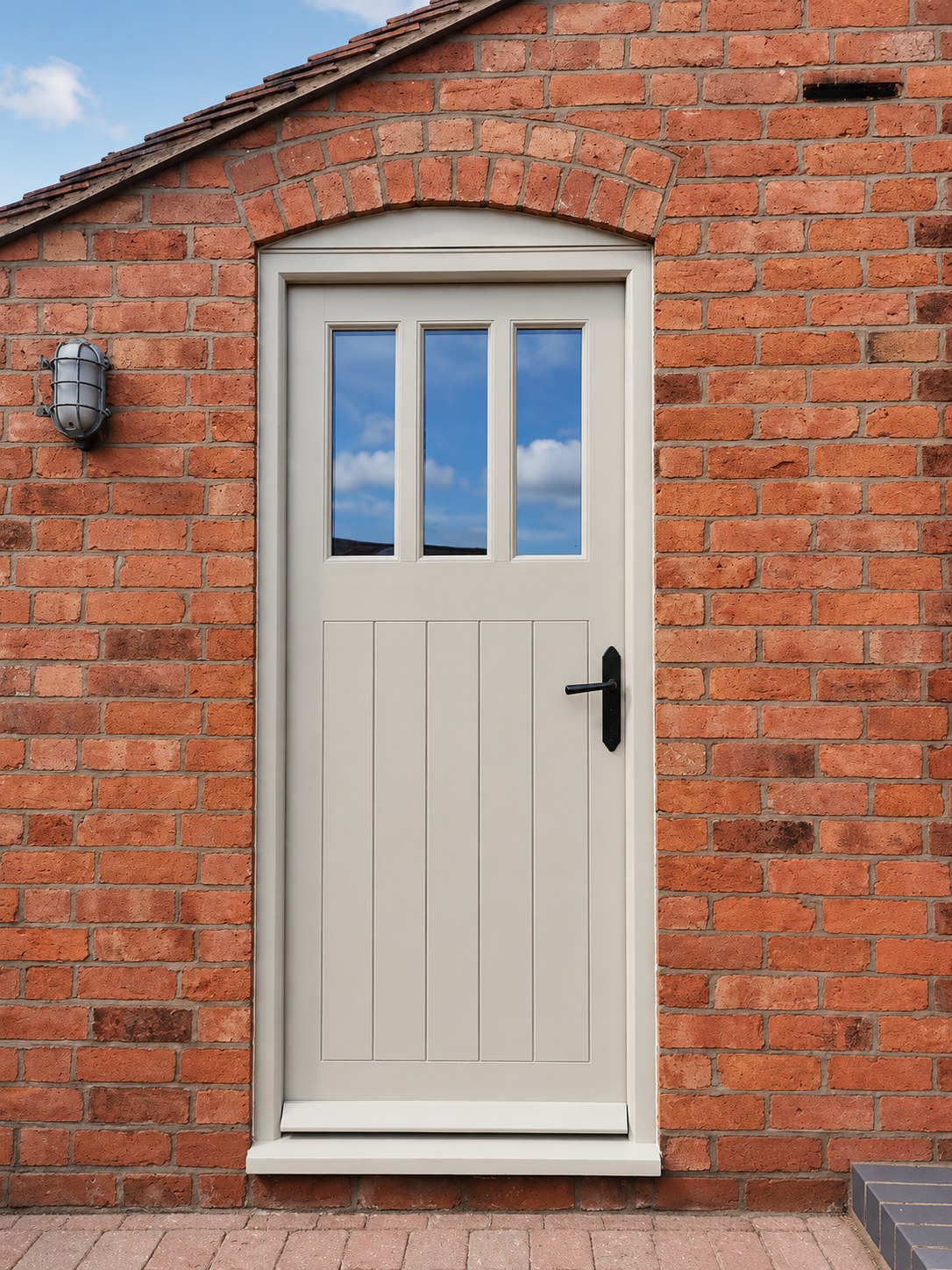 Pale painted door in a brick opening