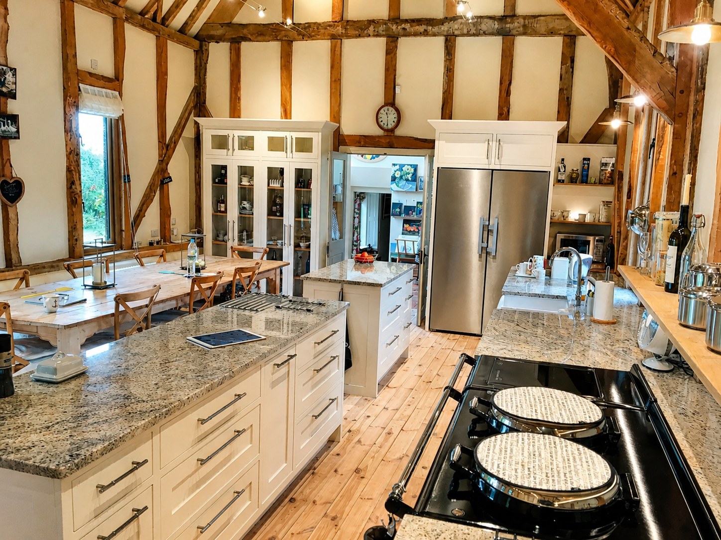 Kitchen cabinetry within a timber-framed room