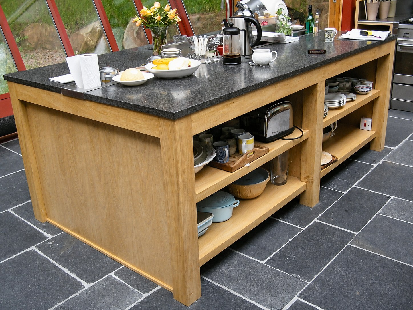 Timber kitchen island with open lower shelving