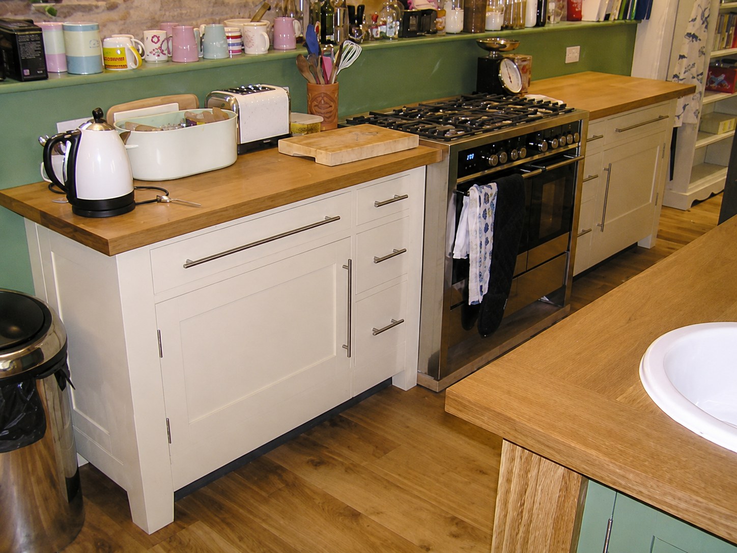 Painted kitchen cabinets beside a range cooker