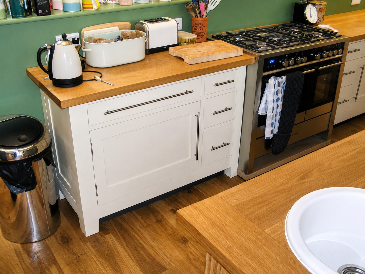 Kitchen drawers and cupboards beneath a timber worktop