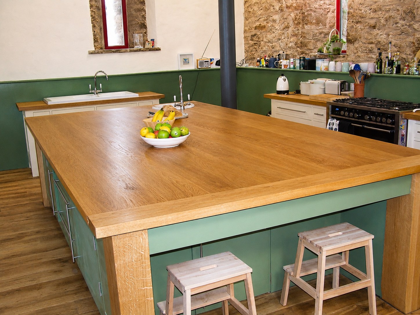 Timber island worktop and painted kitchen cabinetry