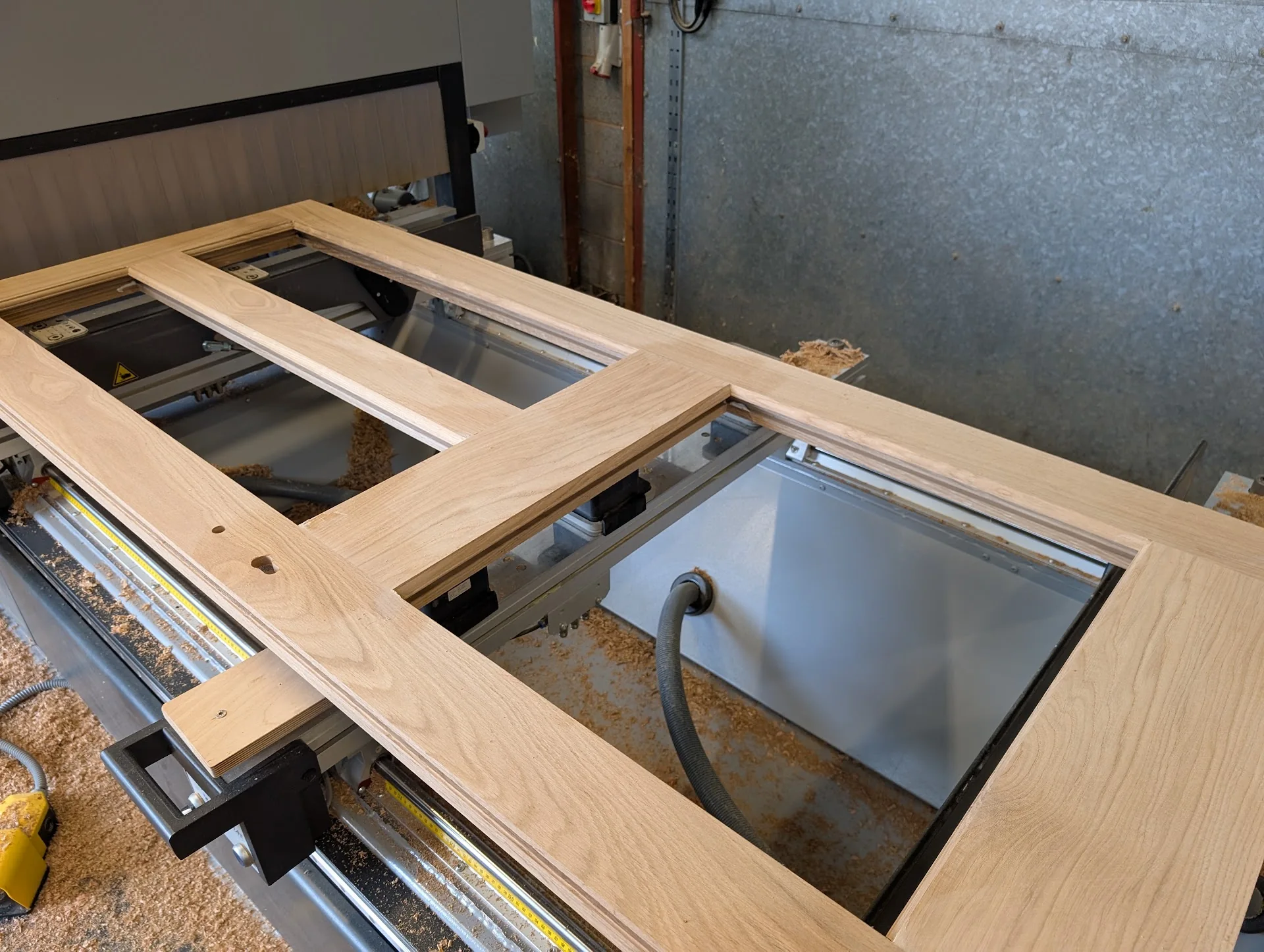 Timber door being machined in the workshop