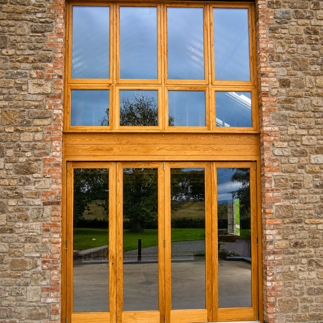 Timber glazed screen with central double doors