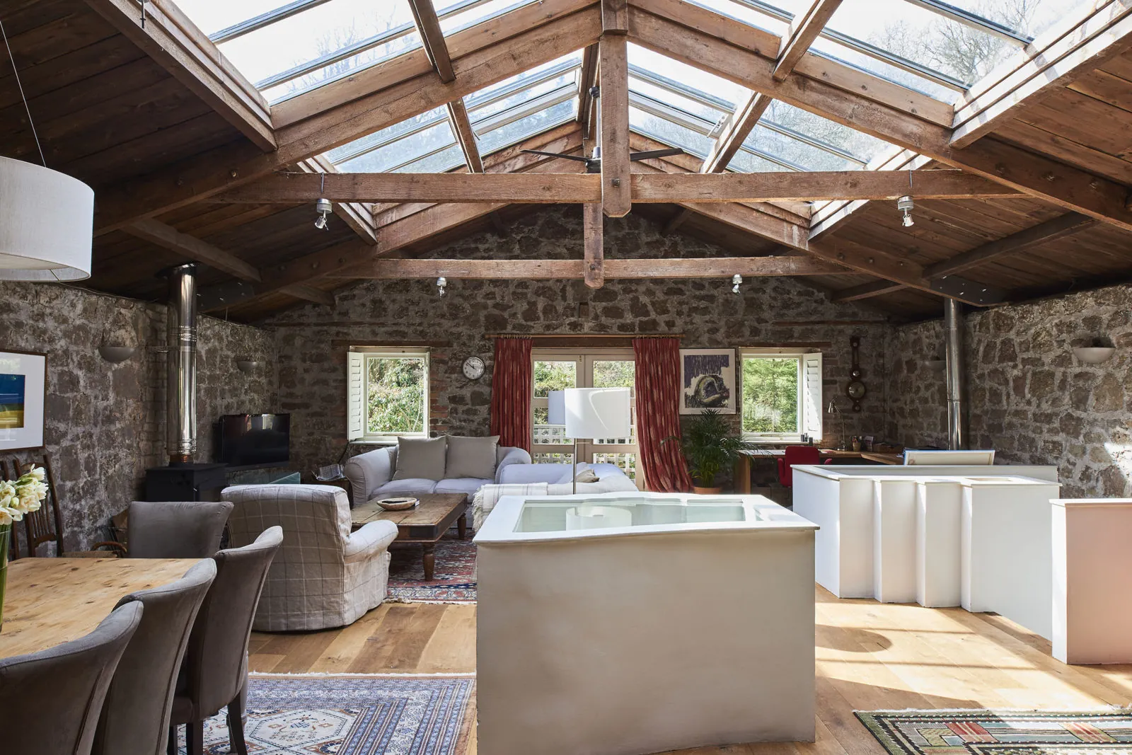 Timber-framed glazed roof over a garden room