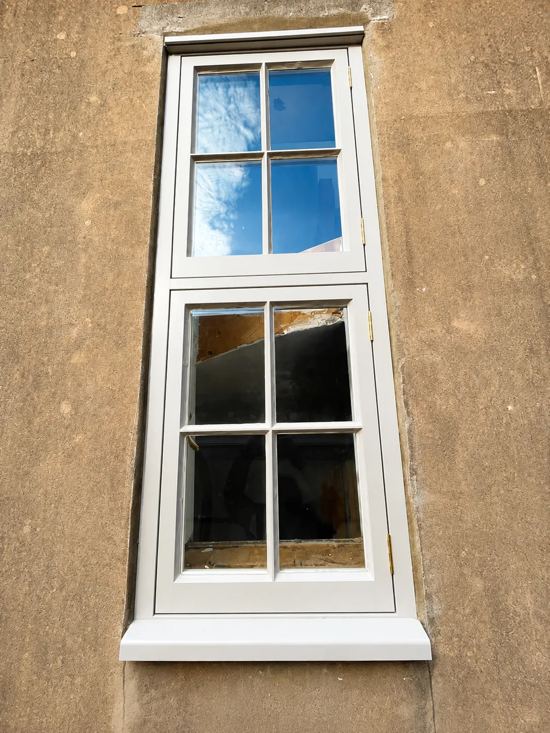 White painted window with opening lower casement