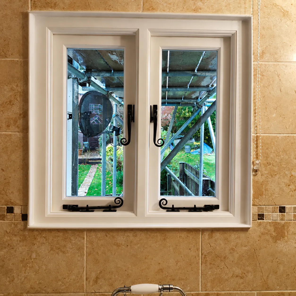 Natural timber casement with decorative handles