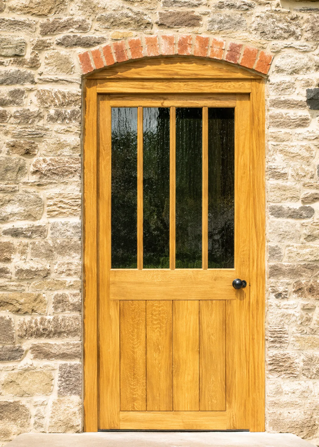 Timber entrance door with vertical glazed panels