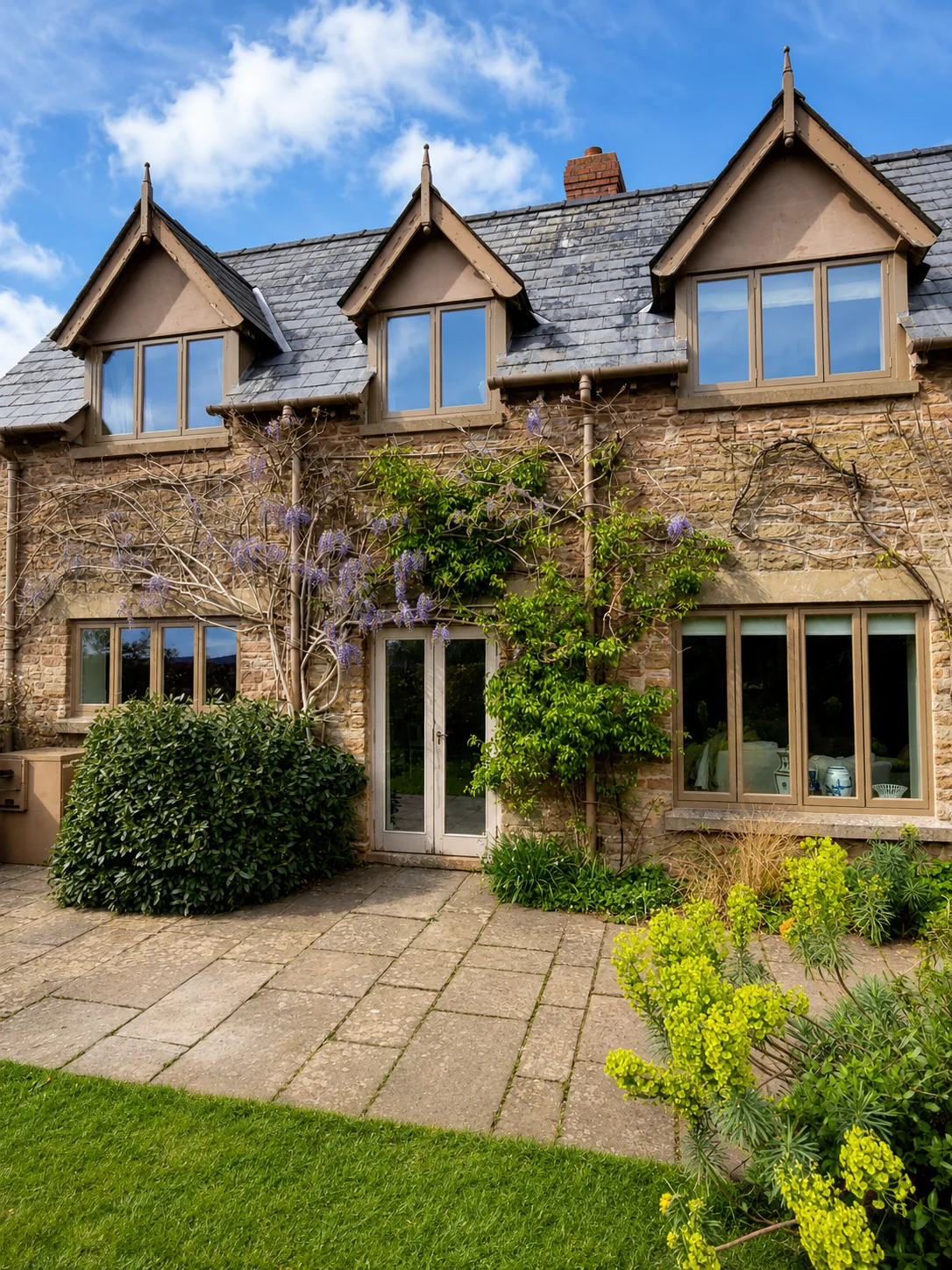 Timber windows and doors in a gabled stone house