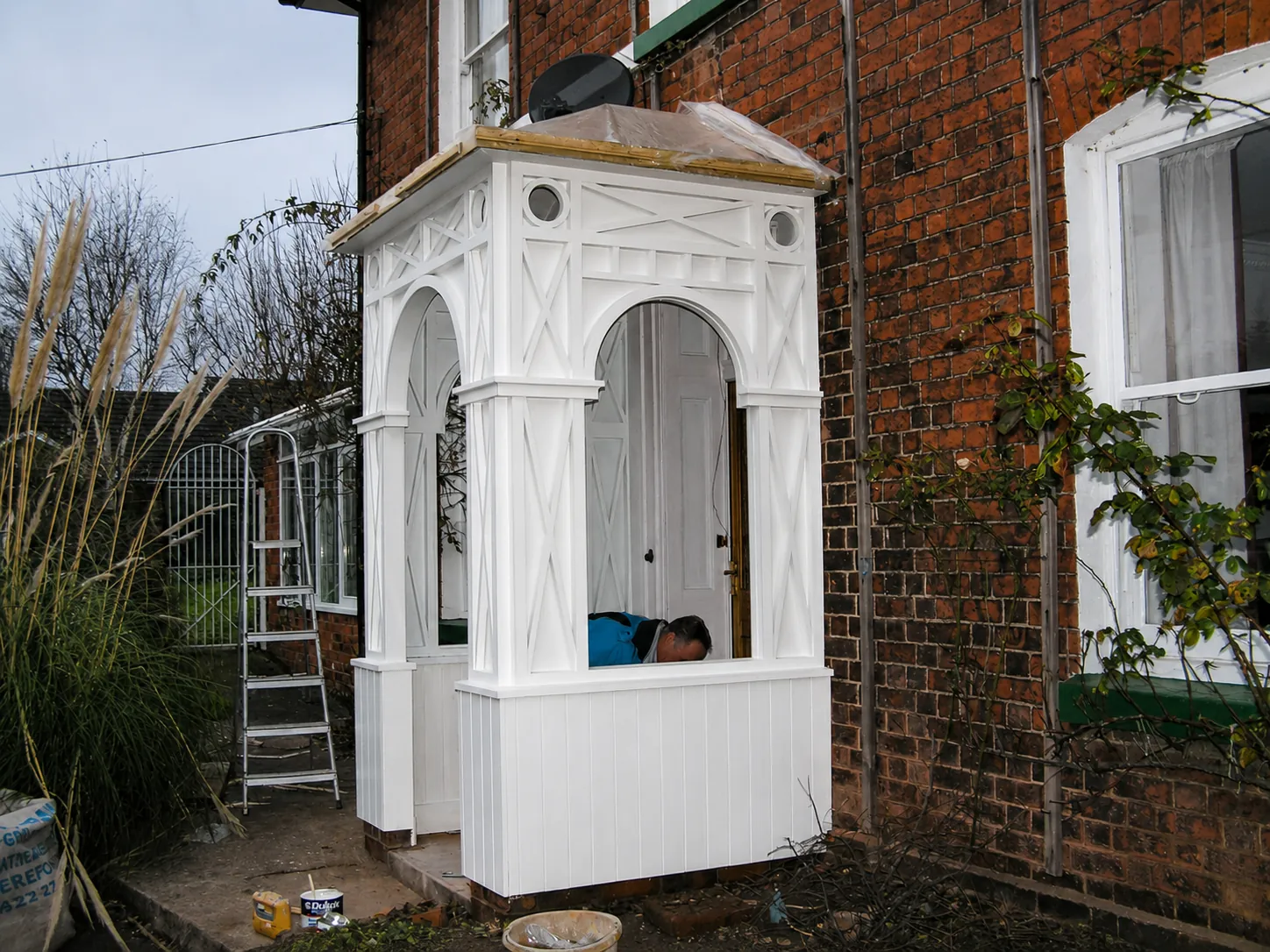 White painted enclosed entrance porch