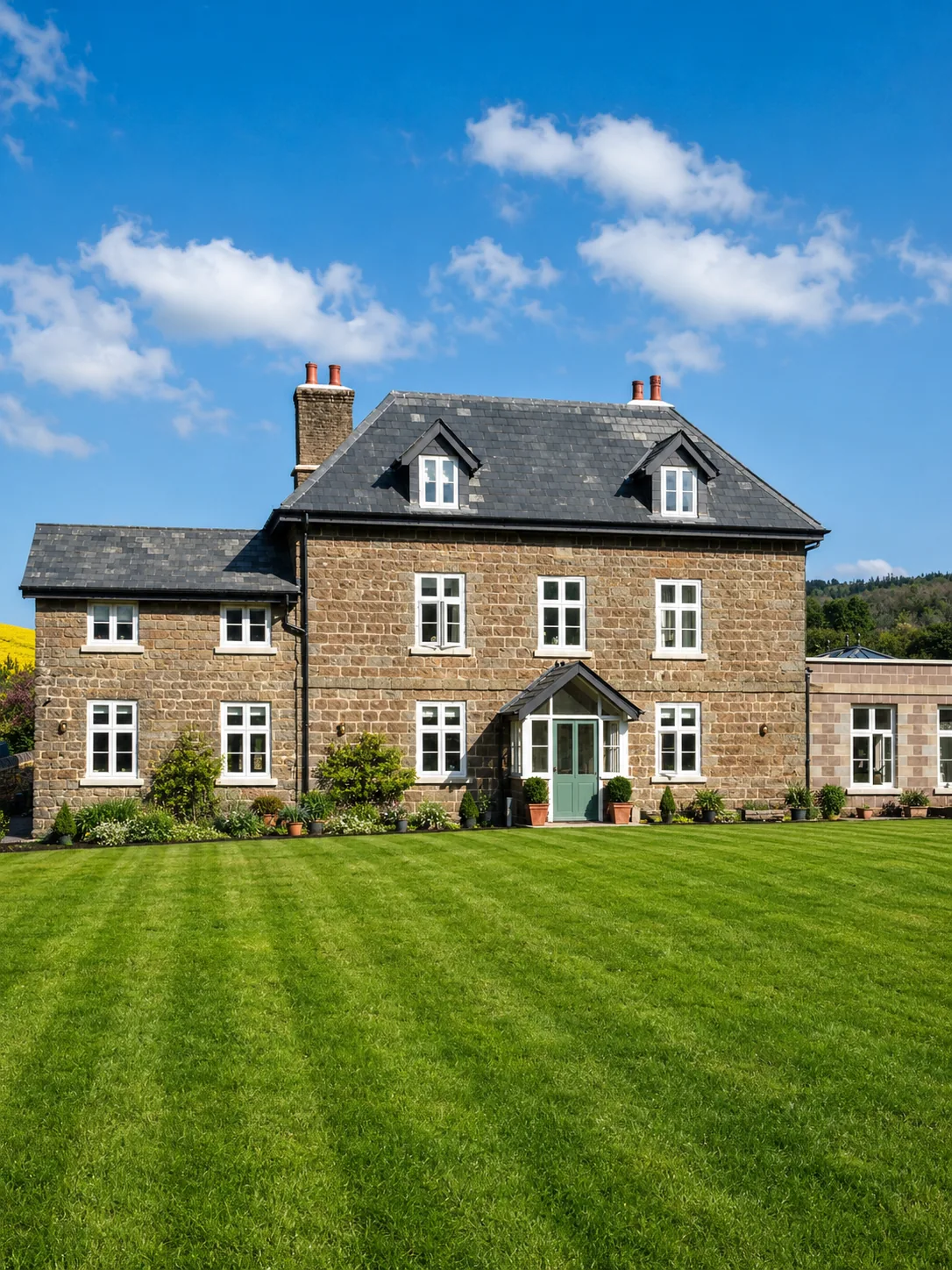 Painted windows across a stone house